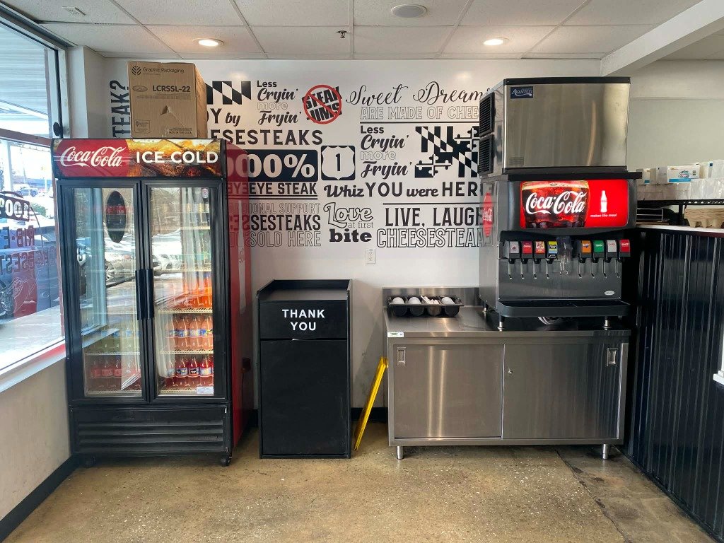 Interior of Cheesesteak & Co. with drinks station